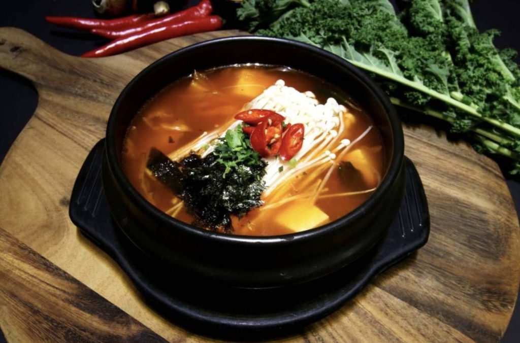 A hot pot of Korean kimchi stew with vegetables