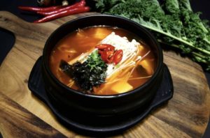 A hot pot of Korean kimchi stew with vegetables