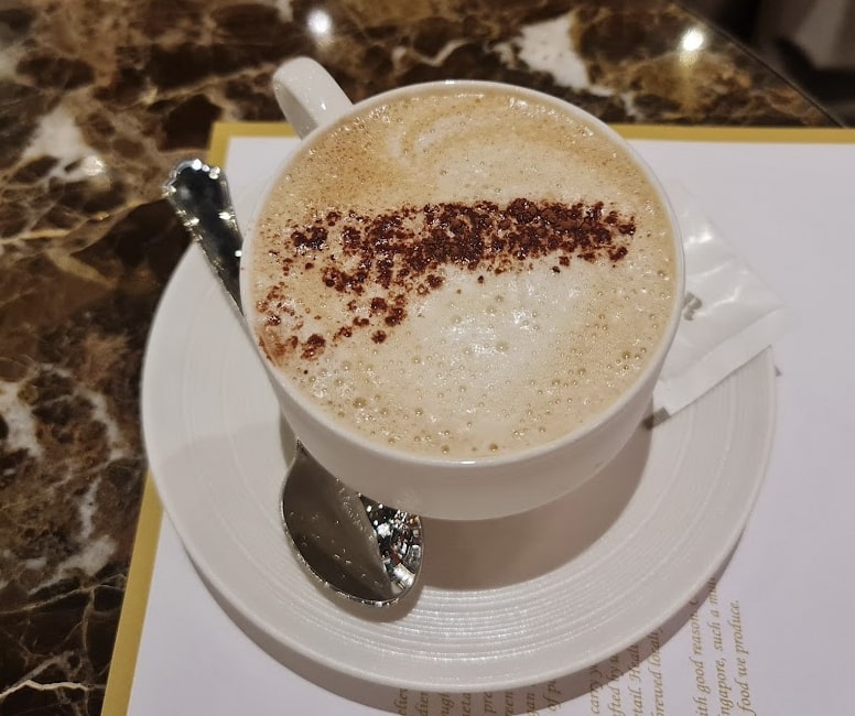 A cup of coffee with granule art
