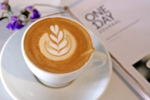Hot cup of coffee with latte art