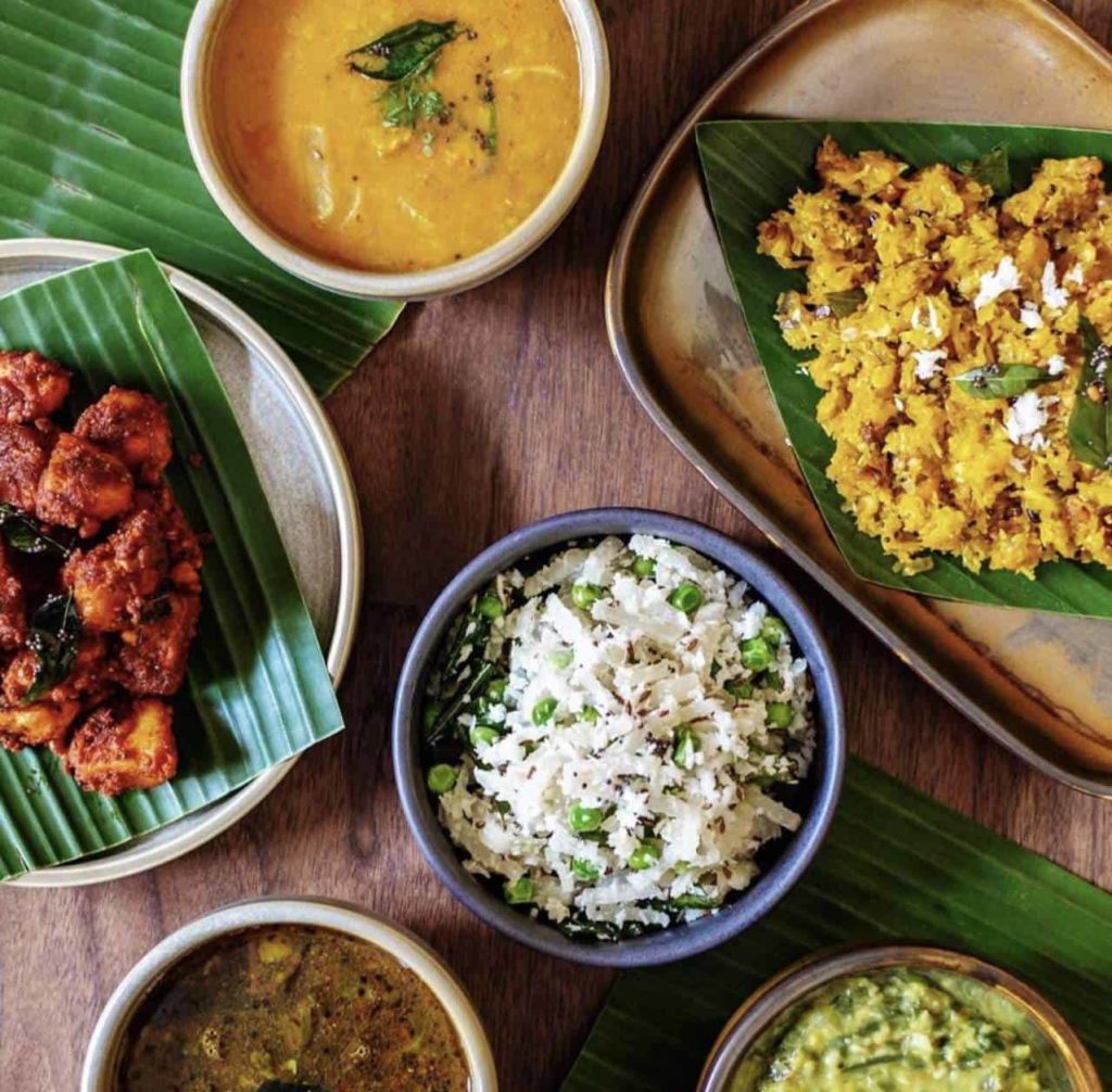 Assorted Indian vegan dishes from rice, sauce, and soup
