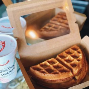 An open box of vegan waffles with a pint of ice cream