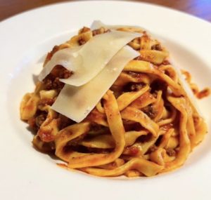Red sauce Italian pasta with cheese topping