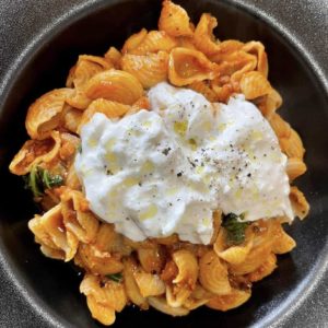 Pork sausage ragu pasta with cheese topping