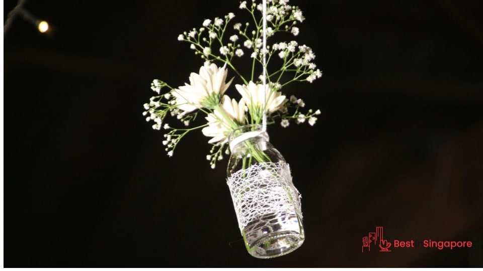 Feature flowers in hanging bottles