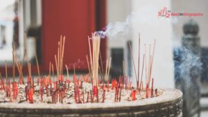 Offering Flowers, Candles, and Joss Sticks
