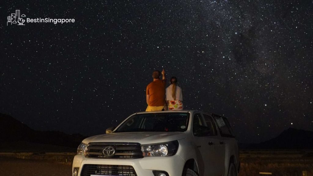 Lay down on the green and gaze at the stars